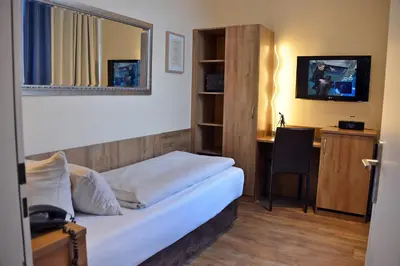 Ein Bett oder Betten in einem Zimmer der Unterkunft Arthotel Munich