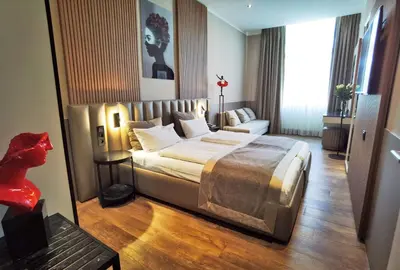 Ein Bett oder Betten in einem Zimmer der Unterkunft Arthotel Munich