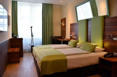 Ein Bett oder Betten in einem Zimmer der Unterkunft Arthotel Munich