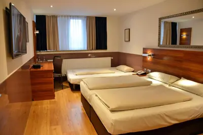 Ein Bett oder Betten in einem Zimmer der Unterkunft Arthotel Munich