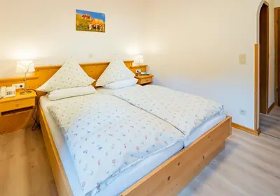 Ein Bett oder Betten in einem Zimmer der Unterkunft Hotel-Pension-Ostler