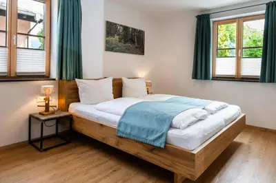 Ein Bett oder Betten in einem Zimmer der Unterkunft Ferienwohnungen Zober am Mühlbach