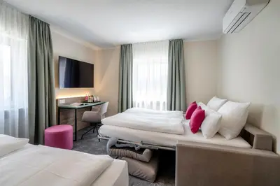 TV/Unterhaltungsangebot in der Unterkunft Boutique Hotel Erb München Parsdorf
