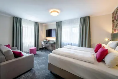 Ein Bett oder Betten in einem Zimmer der Unterkunft Boutique Hotel Erb München Parsdorf