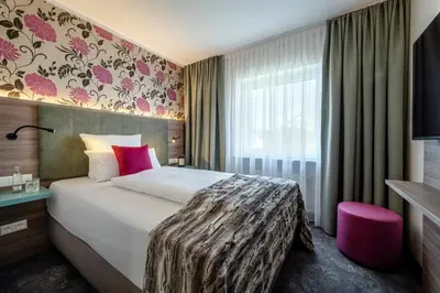 Ein Bett oder Betten in einem Zimmer der Unterkunft Boutique Hotel Erb München Parsdorf