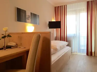 Ein Bett oder Betten in einem Zimmer der Unterkunft Hotel Sollner Hof
