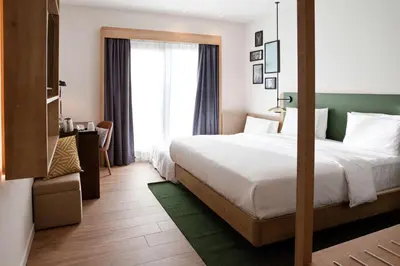 Ein Bett oder Betten in einem Zimmer der Unterkunft Hilton Garden Inn Munich Messe