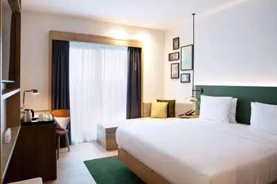 Ein Bett oder Betten in einem Zimmer der Unterkunft Hilton Garden Inn Munich Messe