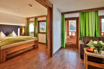 Ein Bett oder Betten in einem Zimmer der Unterkunft Feuriger Tatzlwurm Berghotel & Spa, BW Signature Collection