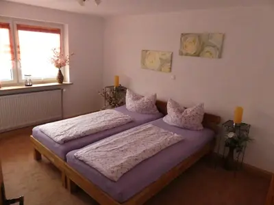 Ein Bett oder Betten in einem Zimmer der Unterkunft Ferienwohnung Bergblick