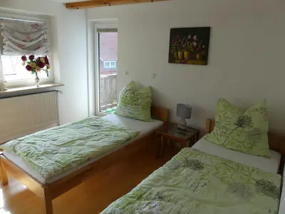 Ein Bett oder Betten in einem Zimmer der Unterkunft Ferienwohnung Bergblick