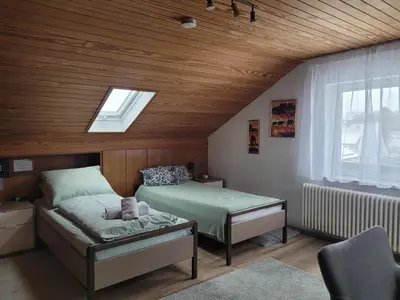 Ein Bett oder Betten in einem Zimmer der Unterkunft Pension Schlafstuhl