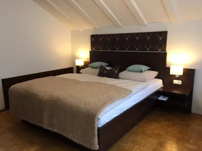 Ein Bett oder Betten in einem Zimmer der Unterkunft Hotel Alpenhof Postillion