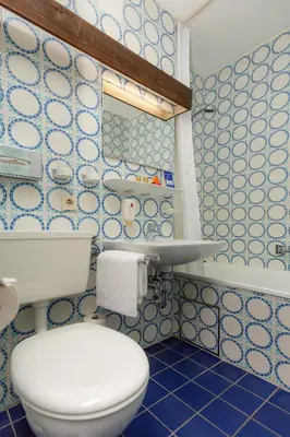 Ein Badezimmer in der Unterkunft Hotel Alpenhof Postillion