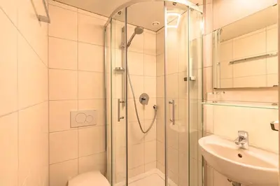 Ein Badezimmer in der Unterkunft Hotel Alpensonne