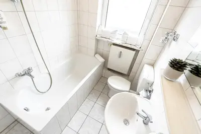 Ein Badezimmer in der Unterkunft Hotel Fresh INN