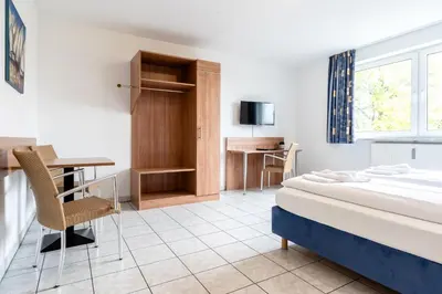 Ein Bett oder Betten in einem Zimmer der Unterkunft Hotel Fresh INN