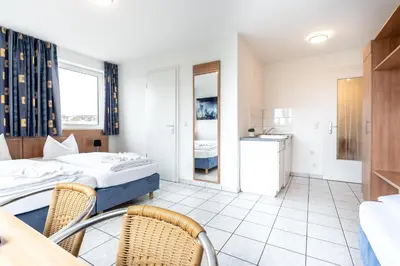 Ein Bett oder Betten in einem Zimmer der Unterkunft Hotel Fresh INN