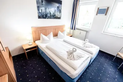 Ein Bett oder Betten in einem Zimmer der Unterkunft Hotel Fresh INN