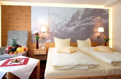 Ein Bett oder Betten in einem Zimmer der Unterkunft Landhotel Böld Oberammergau