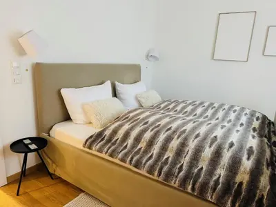 Ein Bett oder Betten in einem Zimmer der Unterkunft ALPEN WOHLFÜHLQUARTIER