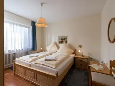 Ein Bett oder Betten in einem Zimmer der Unterkunft Ferienwohnanlage Oberaudorf B 3 mit Hallenbad und Sauna