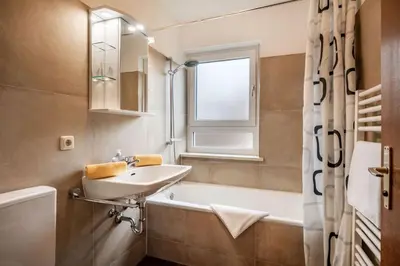 Ein Badezimmer in der Unterkunft Ferienwohnanlage Oberaudorf B 3 mit Hallenbad und Sauna