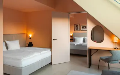 Ein Bett oder Betten in einem Zimmer der Unterkunft Hotel Miano by Limehome