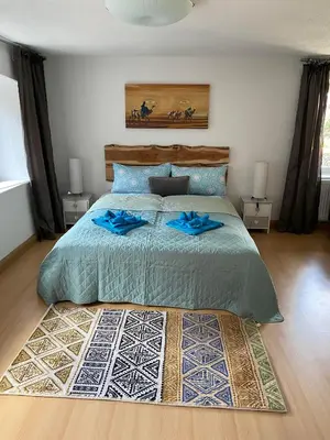 Ein Bett oder Betten in einem Zimmer der Unterkunft Ferienhaus-Aladdin