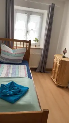 Ein Bett oder Betten in einem Zimmer der Unterkunft Ferienhaus-Aladdin