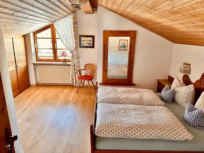 Ein Bett oder Betten in einem Zimmer der Unterkunft Ferienwohnungen Arnika