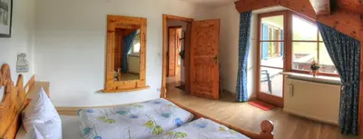 Ein Bett oder Betten in einem Zimmer der Unterkunft Ferienwohnungen Arnika