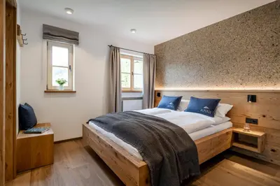 Ein Bett oder Betten in einem Zimmer der Unterkunft Alperie Ferienhaus