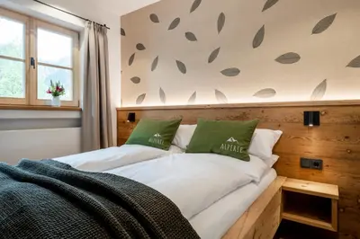 Ein Bett oder Betten in einem Zimmer der Unterkunft Alperie Ferienhaus