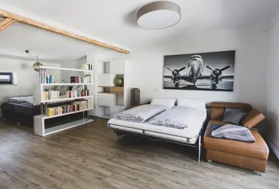Ein Bett oder Betten in einem Zimmer der Unterkunft Modernes Loft vor den Toren des Chiemgaus