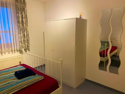 Ein Bett oder Betten in einem Zimmer der Unterkunft Ferienwohnung Dinkelscherben