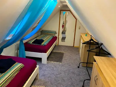 Ein Bett oder Betten in einem Zimmer der Unterkunft Ferienwohnung Dinkelscherben