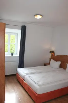 Ein Bett oder Betten in einem Zimmer der Unterkunft Hotel Waitzingers