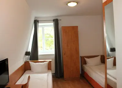 Ein Bett oder Betten in einem Zimmer der Unterkunft Hotel Waitzingers