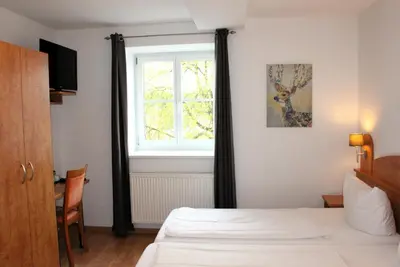 Ein Bett oder Betten in einem Zimmer der Unterkunft Hotel Waitzingers