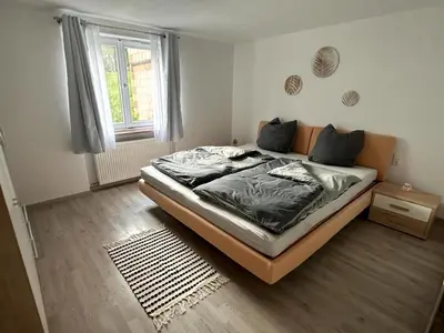 Ein Bett oder Betten in einem Zimmer der Unterkunft Chiemsee - Idyll