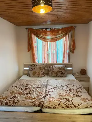 Ein Bett oder Betten in einem Zimmer der Unterkunft Chiemsee - Idyll