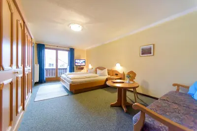 Ein Bett oder Betten in einem Zimmer der Unterkunft Kleines Hotel Edeltraud