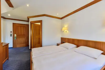 Ein Bett oder Betten in einem Zimmer der Unterkunft Hotel Fischerwirt
