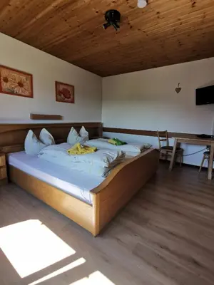 Ein Bett oder Betten in einem Zimmer der Unterkunft Hotel Garni Austermayer