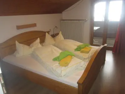 Ein Bett oder Betten in einem Zimmer der Unterkunft Hotel Garni Austermayer