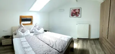 Ein Bett oder Betten in einem Zimmer der Unterkunft Ferienwohnung Alpenfex
