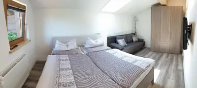 Ein Bett oder Betten in einem Zimmer der Unterkunft Ferienwohnung Alpenfex