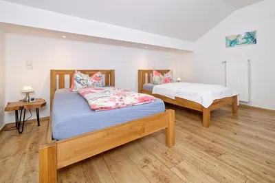 Ein Bett oder Betten in einem Zimmer der Unterkunft FeWo Am Stocket