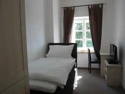 Ein Bett oder Betten in einem Zimmer der Unterkunft Pension Lechner